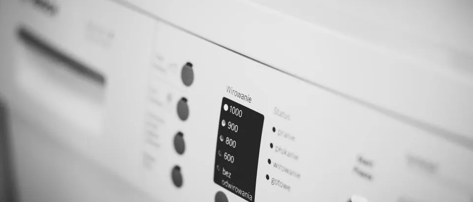 Washing machine repair service — a washing machine in a home laundry room